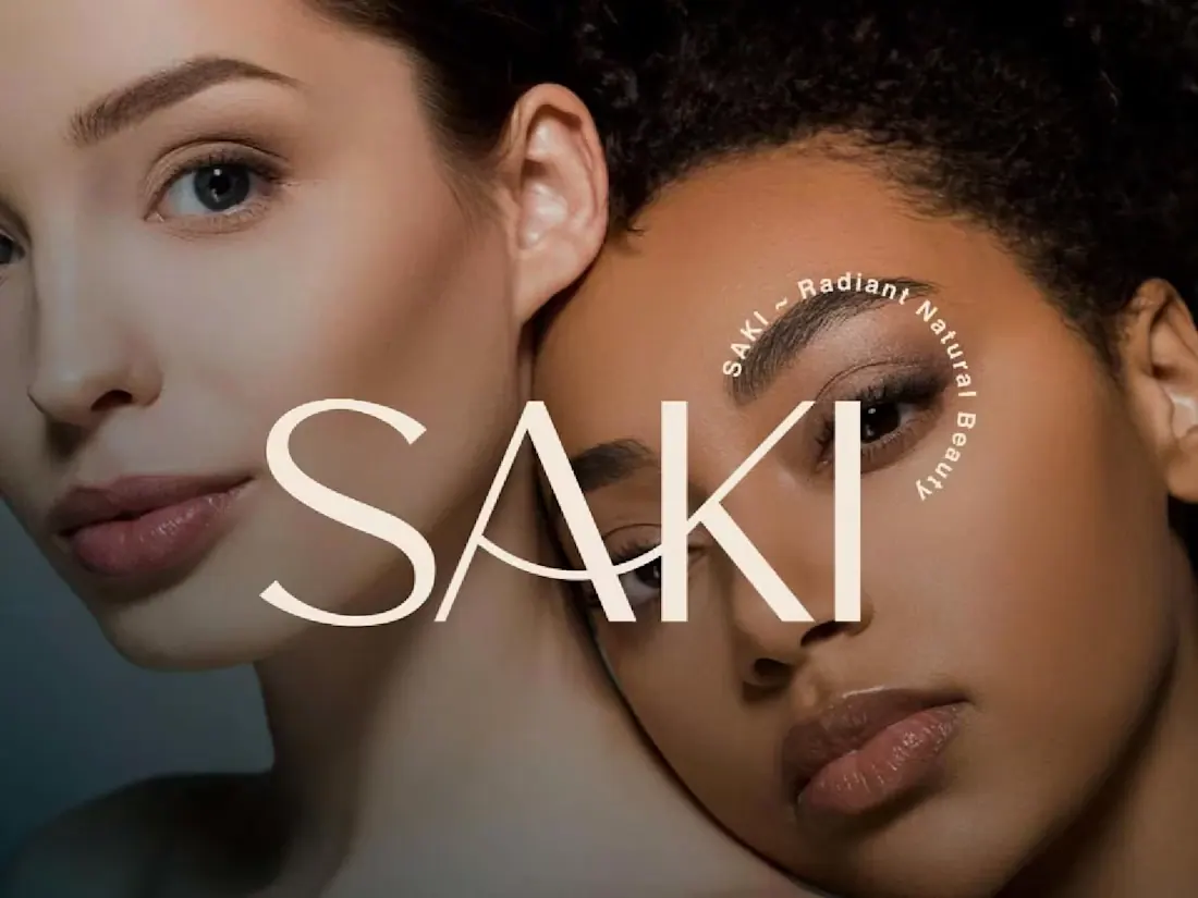 SAKI organic beauty campaign featuring two portraits and a spacious cream wordmark.